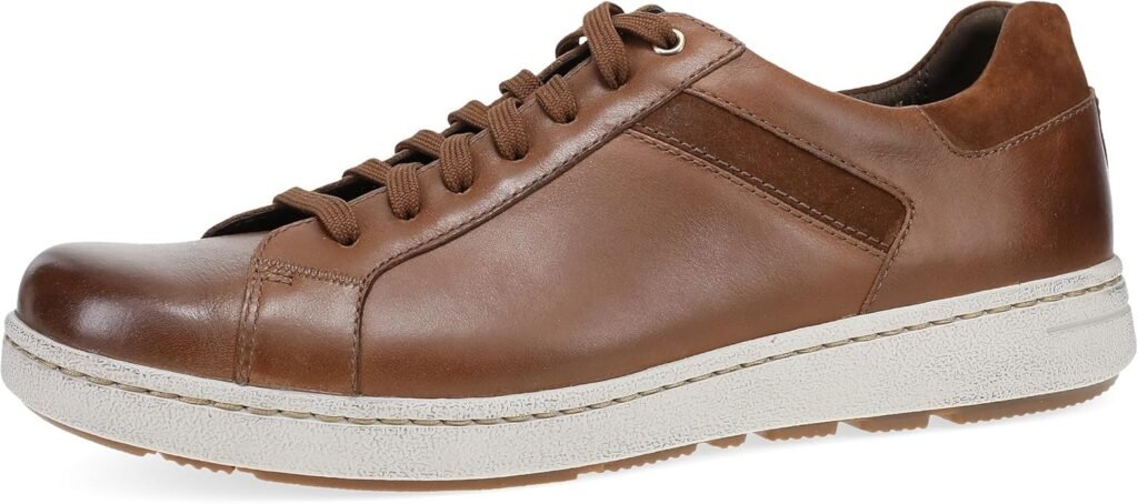 Side view of the Dansko Professional Clog featuring its characteristic rocker bottom and reinforced toe box.